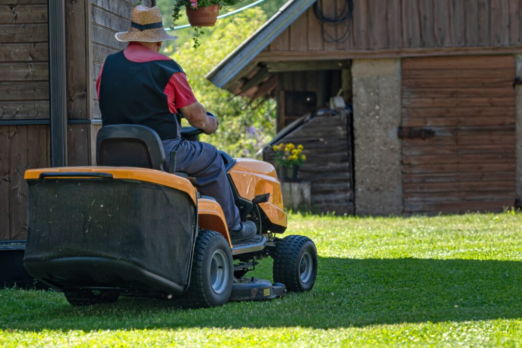senior man riding lawn mower battery amherstburg ontario